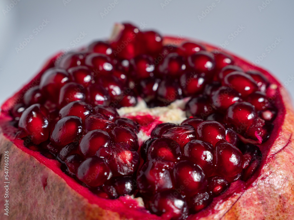 Ripe pomegranate. Fresh juicy pomegranate on a light background. Ripe pomegranate. Fresh juicy pomegranate on a light background.