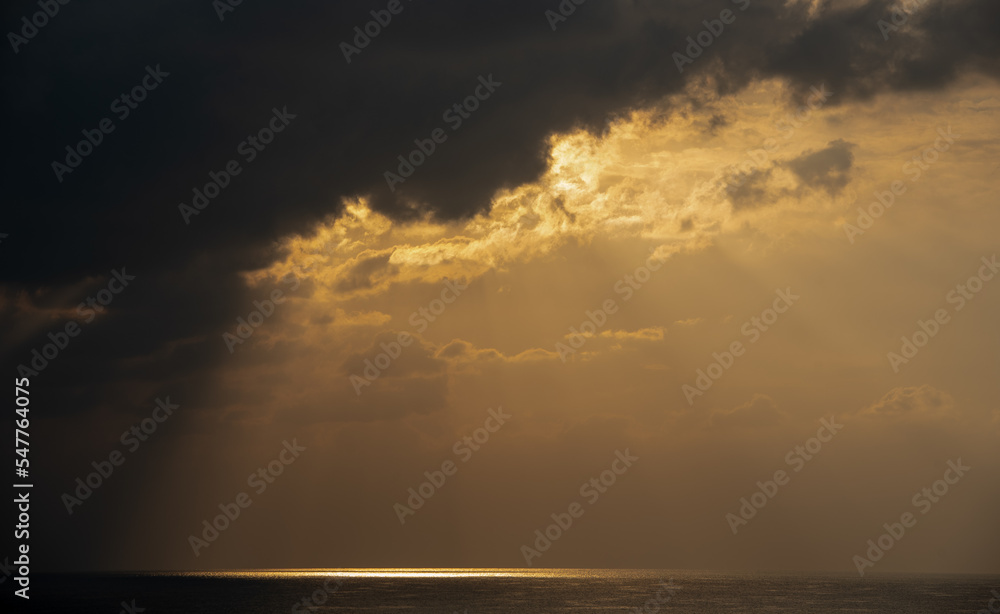 Sunrise in the sea with cloud stormy clouds and orange colour. Seascape in the morning. Sun rays in the ocean Sunrise in the sea with cloud stormy clouds and orange colour. Seascape in the morning. Sun rays in the ocean