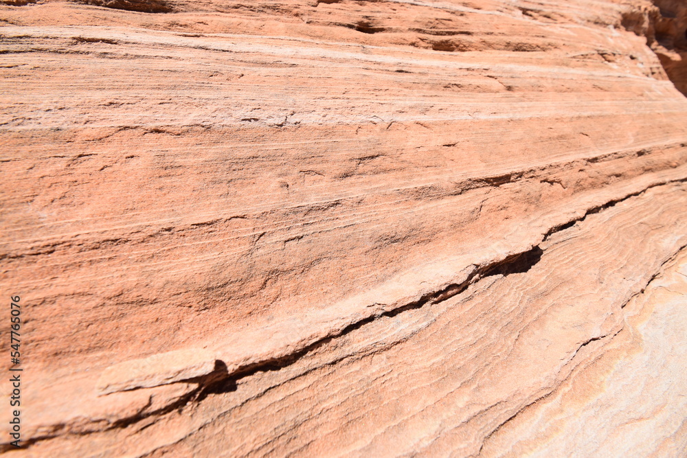 Fototapeta premium Close-up of red sandstone formation, pattern shaped by erosion in the desert