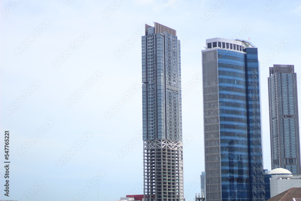 Background photo of two tall blue buildings