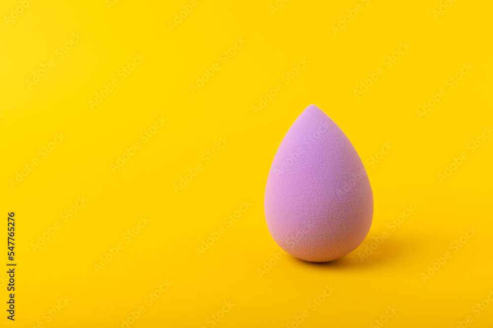 Beauty blender. Cosmetic sponge on a yellow background. MOCAP. Sponge for applying foundation and concealer. Beauty concept. Space for text. Space for copy space. Beauty blender. Cosmetic sponge on a yellow background. MOCAP. Sponge for applying foundation and concealer. Beauty concept. Space for text. Space for copy space.