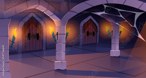 Medieval castle with wooden door with knob, brick wall and torches with fire. Ancient corridor interior with cobweb on stone arch in dark dungeon or old fortress cartoon vector illustration.