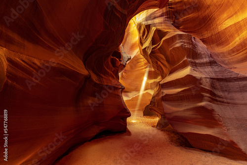 Famous midday sun ray in a slot canyon Antelope. The Navajo reservation near Page, Arizona, USA