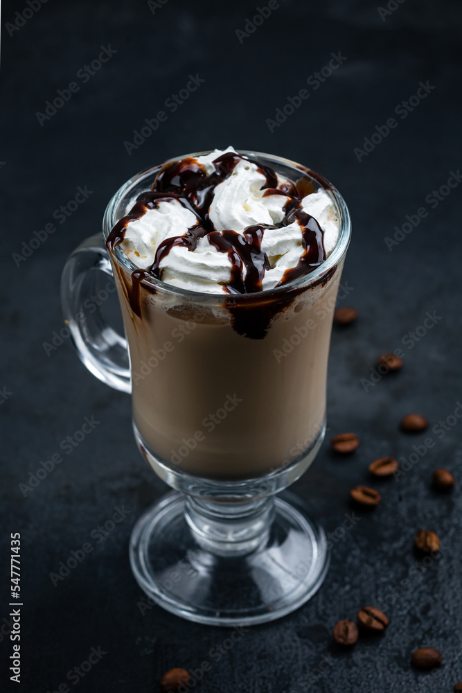 Coffee with cream and chocolate syrup in a mug. Coffee with cream and chocolate syrup in a mug.