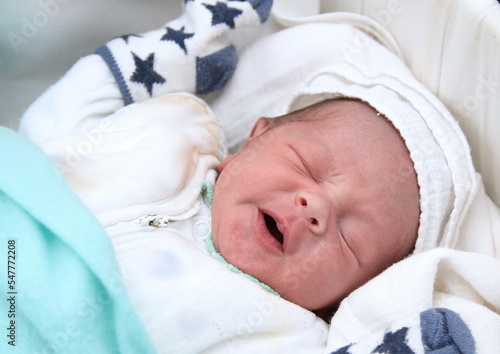 baby waking up after a good night sleep with people stock photo