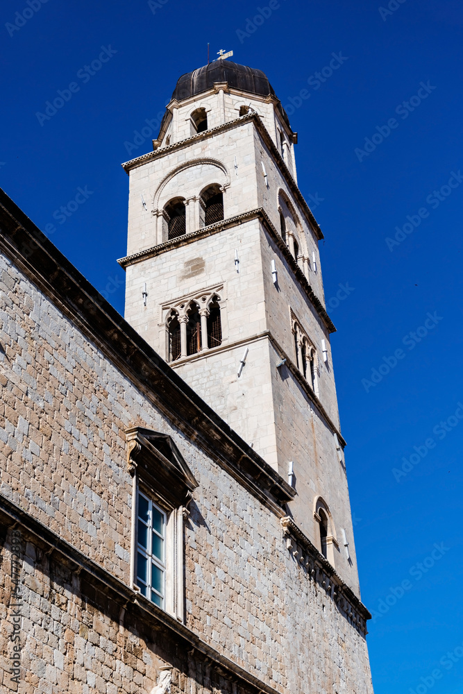 Fototapeta premium Bell tower of the Franciscan Church and Monastery. Dubrovnik, Croatia.