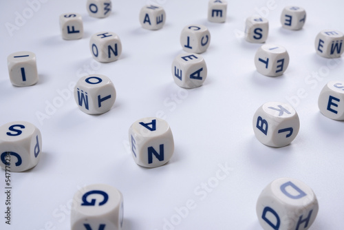  cubes or blocks word with letters randomly on a white background - the concept of , school education or self education photo