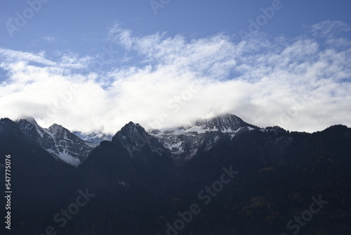 clouds over the mountains  alps in austria  blue sky with clouds