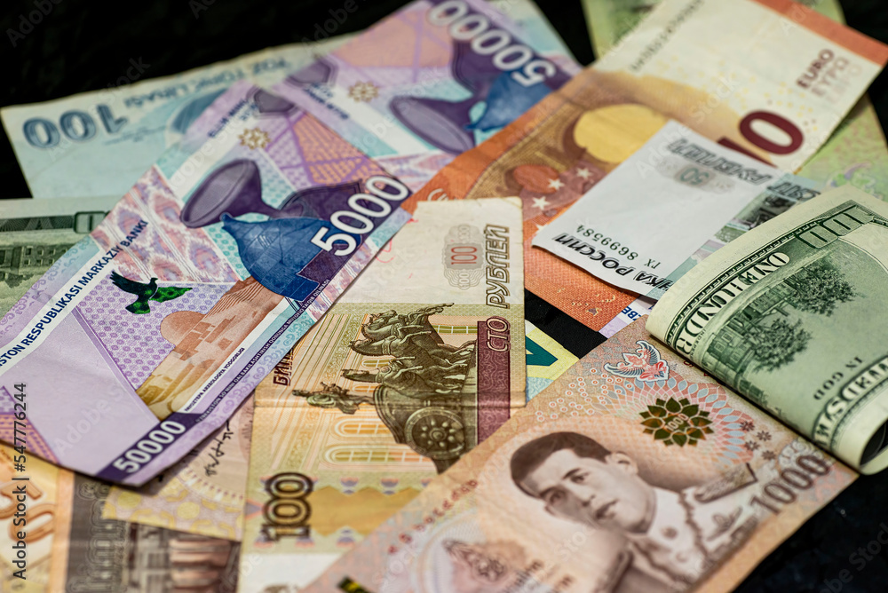 Obraz premium money from different countries in one pile close-up