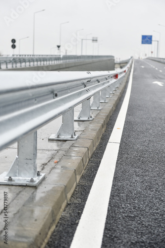 Brand new metallic road barrier for traffic safety on a new constructed road © roibu