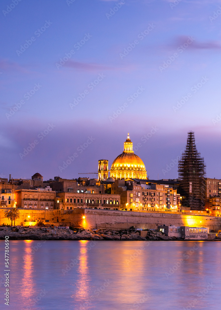 Illuminated skyline of Valletta capitol of Malta at sunset
