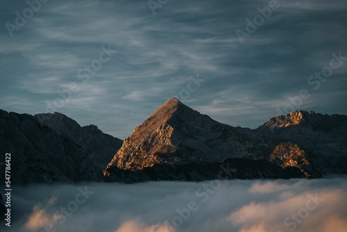 Beautiful view of the last sunrays on Mt. Grintovec in Kamnik and Savinja Alps, Slovenia photo