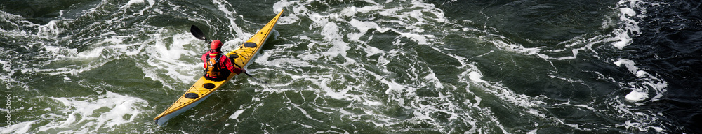 Canoe rowing across Loch Etive, a popular outdoor activity Canoe rowing across Loch Etive, a popular outdoor activity
