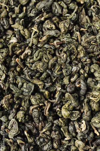 Dry green tea leaves.