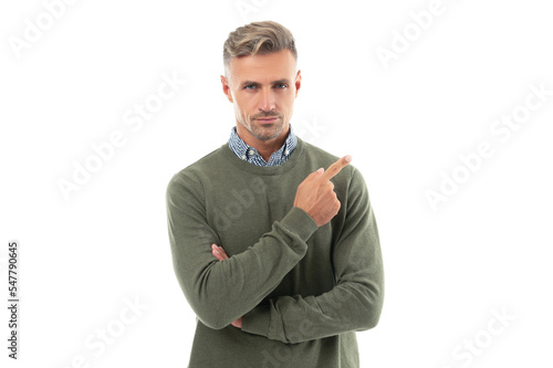 grizzled guy in sweater point finger. grizzled guy has stubble. studio shot of grizzled guy.