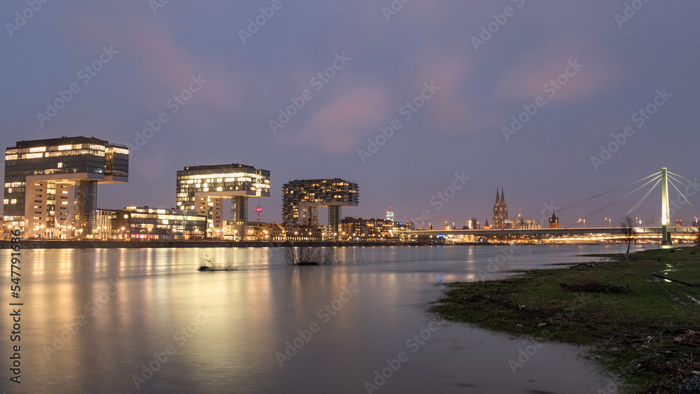 Cologne skyline Rhein flood Blue Hour Crane houses