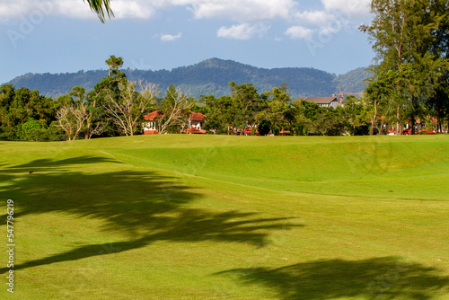Lush golf fairways and greens in a tropical setting