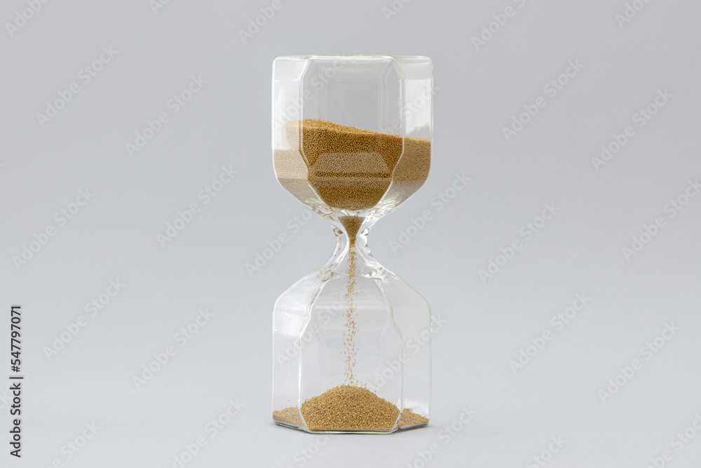 Hourglass on the gray background. Hourglass on the gray background.