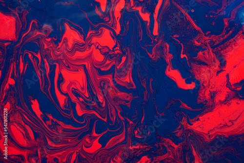 Abstract background from liquid nail polishes,blue and coral tones.