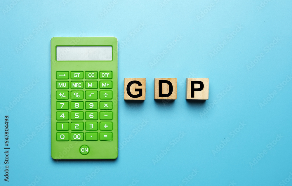 A picture of wooden block written GDP or short form of Gross Domestic Product with calculator insight A picture of wooden block written GDP or short form of Gross Domestic Product with calculator insight