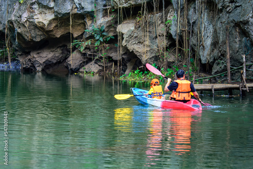 In the morning, learn to kayak, work out, in a river surrounded by mountains in Lampang, Thailand.