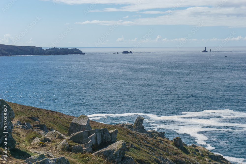 Seascape with path at the coast and view to Pointe du Raz and Vieille lighthouse, Plogoff, Finistere, Brittany, France