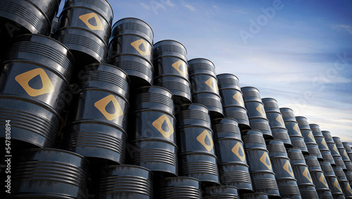 Tableau sur toile Oil barrels with oil signage stacked on top of each other during daylight