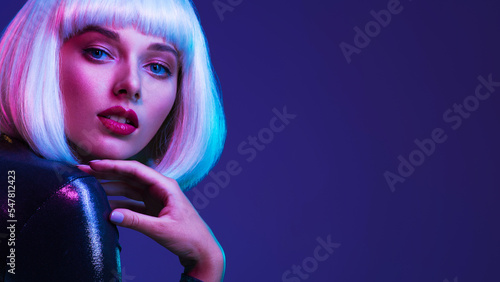Glamour fashion girl. Beauty face with bright makeup. Young beautiful woman in a white wig  bob hairstyle. Close up art portrait  of  an young attractive woman with vivid colors. Stylish blonde.