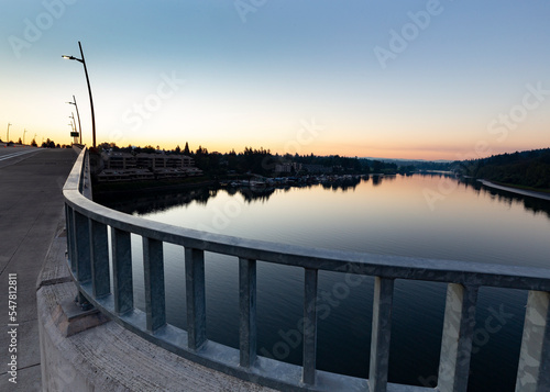 Wide shot of river on a bridge during sunrise