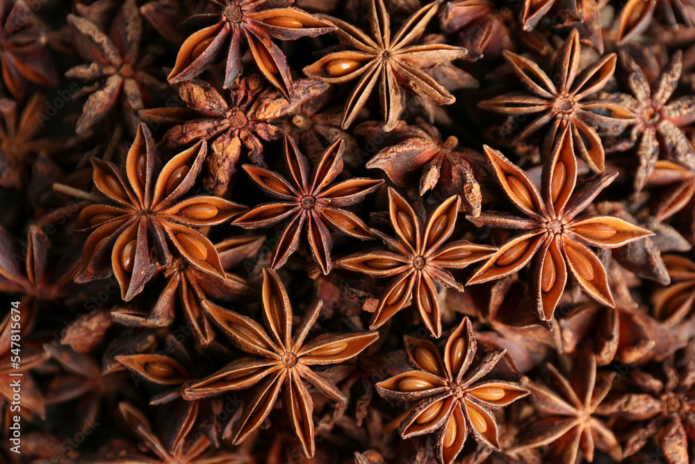 Aromatic anise stars as background, top view - obrazy, fototapety, plakaty 