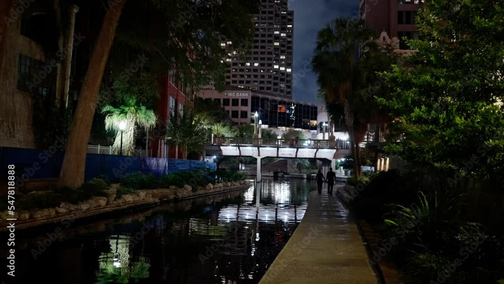 Beautiful Riverwalk in San Antonio with its small restaurants and pubs along the river - view by night - travel photography Beautiful Riverwalk in San Antonio with its small restaurants and pubs along the river - view by night - travel photography