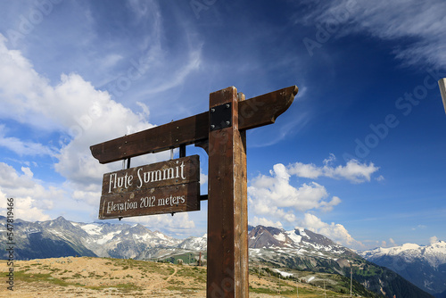Wooden signpost on Flute Summit in Whistler ski area, British Columbia, Canada. © Jara
