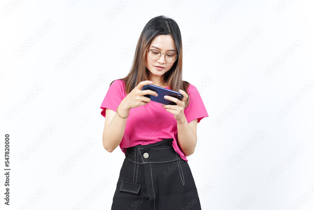 Naklejka premium Playing Mobile Game on Smartphone Of Beautiful Asian Woman Isolated On White Background