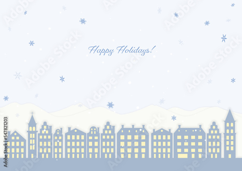 雪の降る北欧の街並みと山の風景