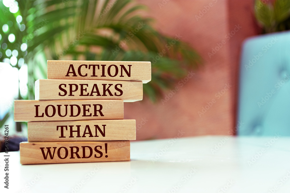 Wooden blocks with words 'Action Speaks Louder Than Words'. Wooden blocks with words 'Action Speaks Louder Than Words'.