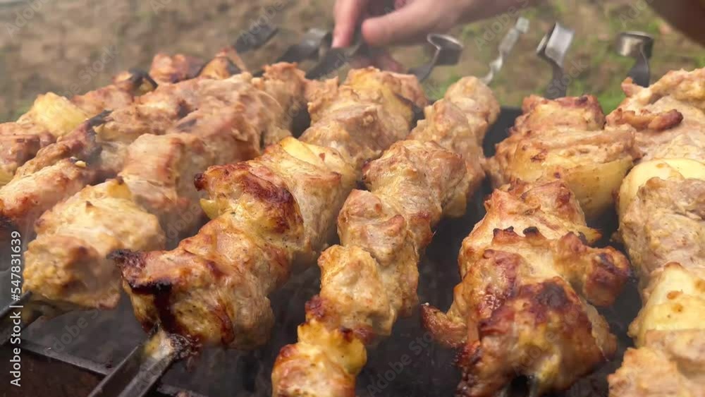 Grilling tasty dish on barbecue. Process of cooking yummy shashlik in nature Grilling tasty dish on barbecue. Process of cooking yummy shashlik in nature