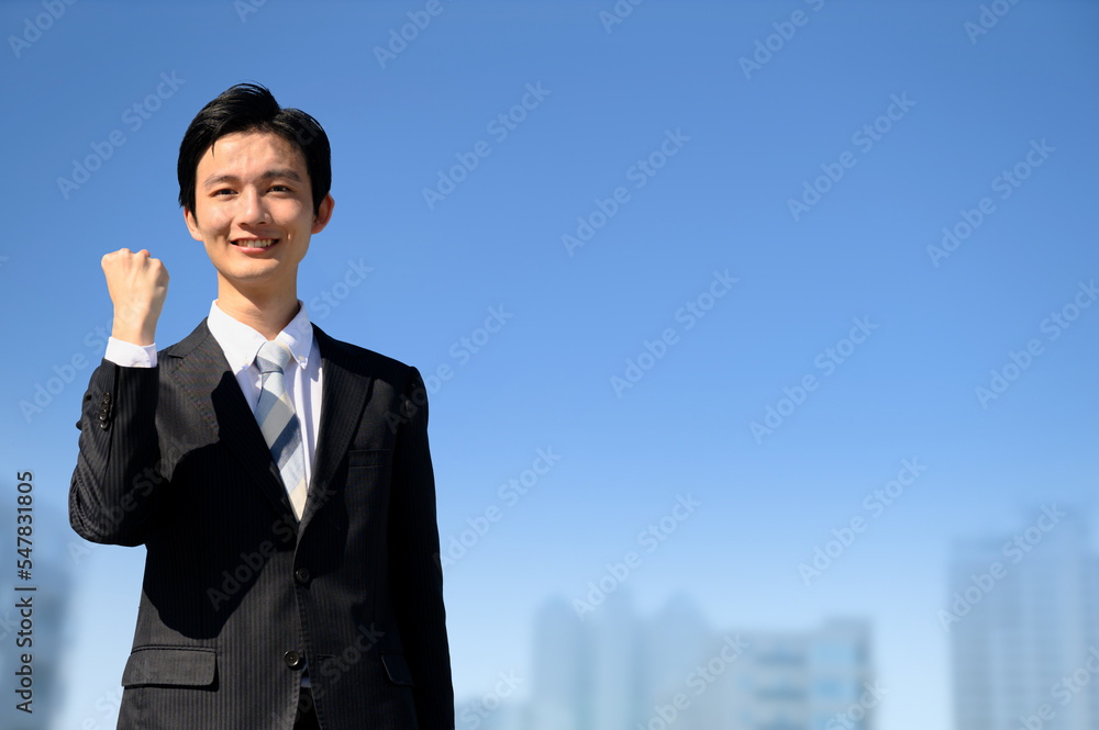 A businessman in a suit looking at the camera and posing with guts. A businessman in a suit looking at the camera and posing with guts.