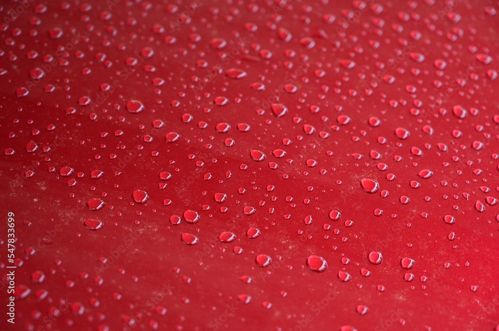 water on red hood car, transportation background water on red hood car, transportation background