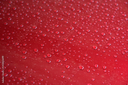 water on red hood car  transportation background