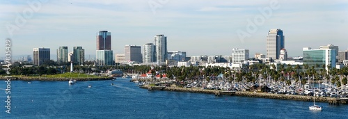 The view of the boat harbor and buildings in the city along Queensway Bay of Long Beach, California, U.S.A