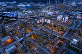 aerial view oil refinery Oil and gas industry, petrochemical plant area and energy concept, oil storage tanks at night time with lights.