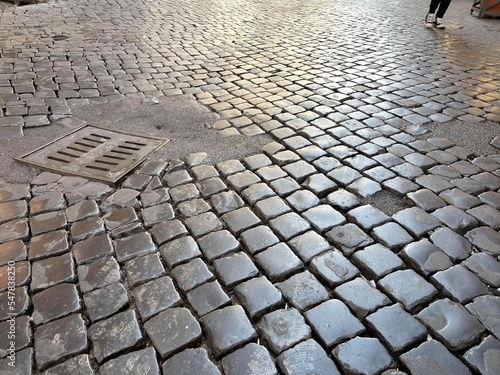 Ancient worn Roman cobblestone street road path Rome Italy 2022 Fototapet