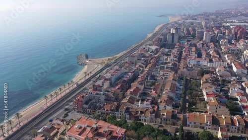 Aerial view of residential areas and the coast of the small Catalan town of Vilasar de Mar, Spain.  photo