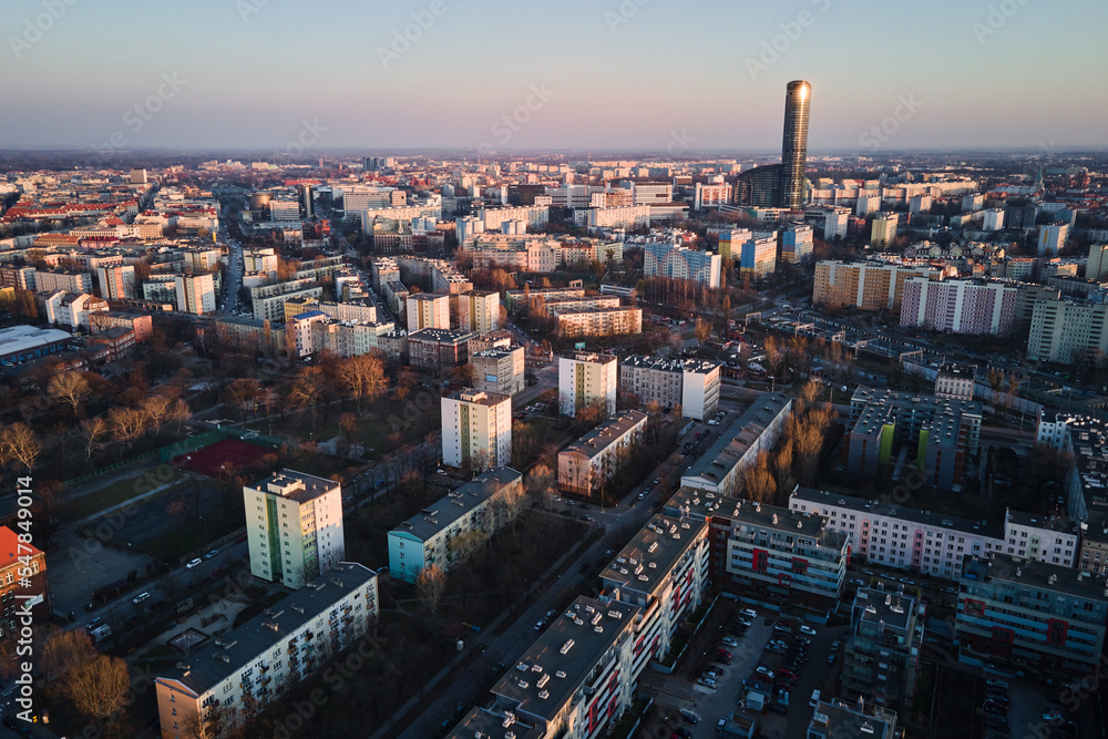 Fototapeta premium Modern residential complex in Wroclaw city, Poland. Aerial view of district with modern residence buildings, courtyards and parked cars.