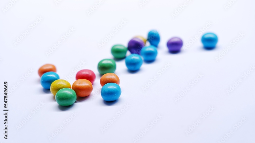 Marbles candy, Lollipops sweets. Candy, top view flat lay on white background. Sweet sucker, lollipop, candy, isolated minimal concept above decoration, food background Marbles candy, Lollipops sweets. Candy, top view flat lay on white background. Sweet sucker, lollipop, candy, isolated minimal concept above decoration, food background
