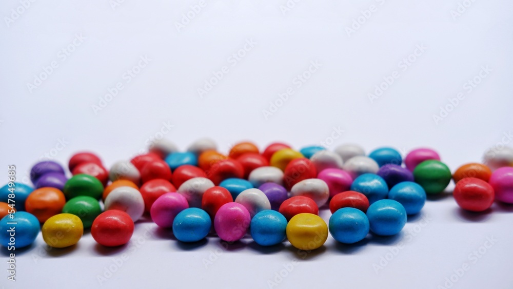 Marbles candy, Lollipops sweets. Candy, top view flat lay on white background. Sweet sucker, lollipop, candy, isolated minimal concept above decoration, food background Marbles candy, Lollipops sweets. Candy, top view flat lay on white background. Sweet sucker, lollipop, candy, isolated minimal concept above decoration, food background