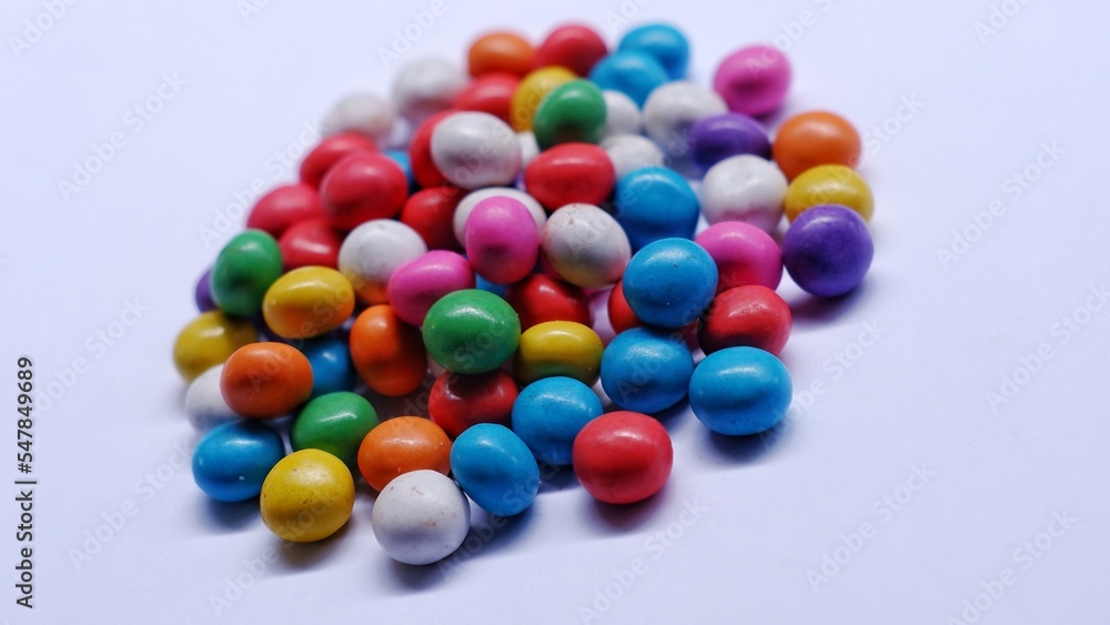 Marbles candy, Lollipops sweets. Candy, top view flat lay on white background. Sweet sucker, lollipop, candy, isolated minimal concept above decoration, food background Marbles candy, Lollipops sweets. Candy, top view flat lay on white background. Sweet sucker, lollipop, candy, isolated minimal concept above decoration, food background