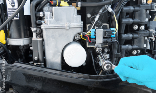 Quadro su tela Repairing  outboard marine engine