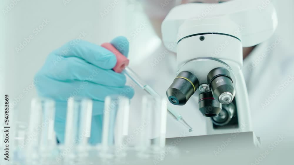 Scientist analyze biochemical samples in advanced scientific laboratory. Medical professional use microscope look microbiological developmental of viral. Biotechnology research in science lab. Scientist analyze biochemical samples in advanced scientific laboratory. Medical professional use microscope look microbiological developmental of viral. Biotechnology research in science lab.