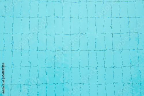 Swimming pool bottom caustics ripple and flow with waves background and Summer background